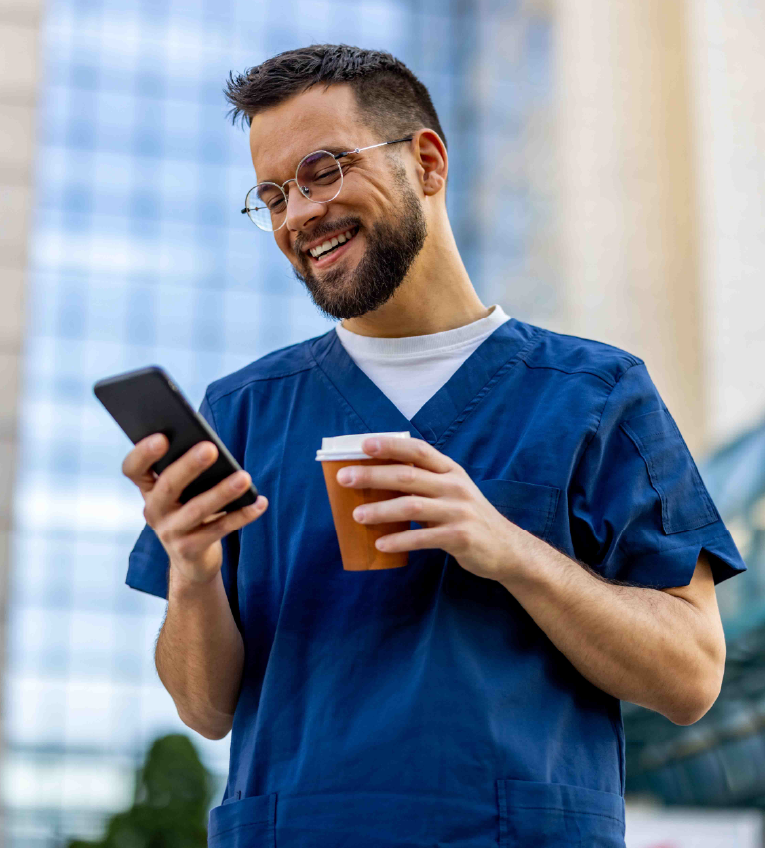 Parents smiling at their newborn baby at home, symbolizing paid parental leave and family time benefits.