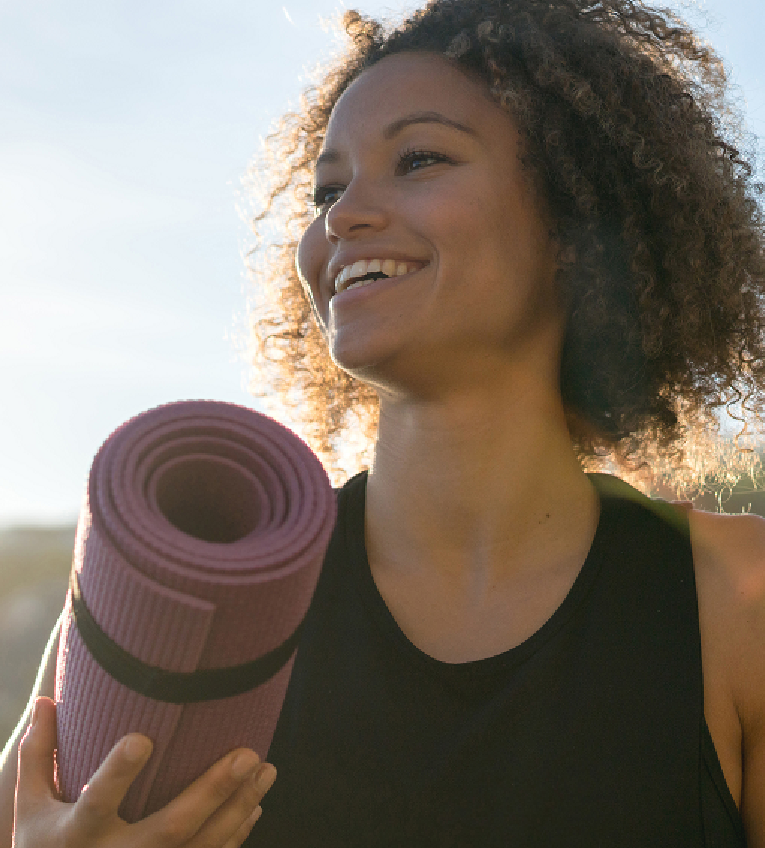Friendly female doctor greeting a patient in the office, representing COPC’s physician training and mentorship programs.