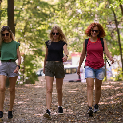 women hiking outdoors in a heavy tick populated area